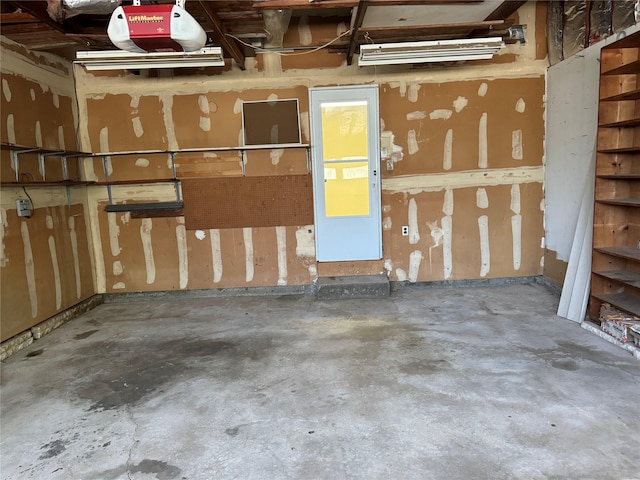 61 John St, Port Jefferson Station, NY 11776 - garage featuring a garage door opener