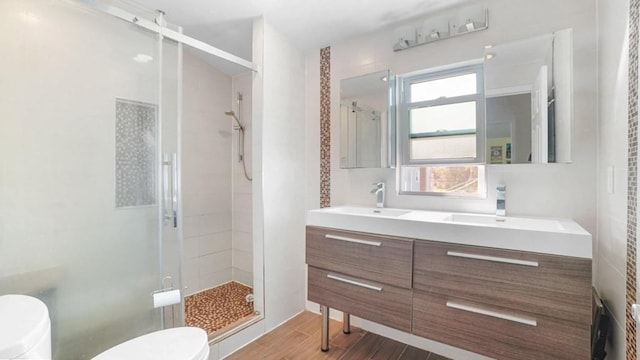 1434 Noel Ave, Hewlett, NY 11557 - full bath with toilet, a stall shower, wood finished floors, and vanity