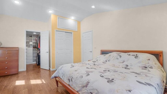1434 Noel Ave, Hewlett, NY 11557 - bedroom with lofted ceiling, wood finished floors, baseboards, a closet, and recessed lighting