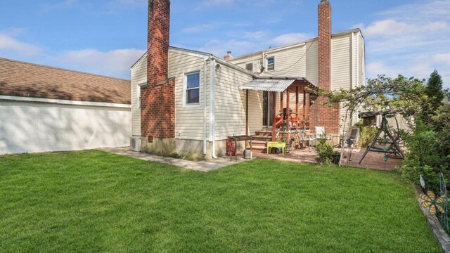 1434 Noel Ave, Hewlett, NY 11557 - back of property with a chimney and a yard
