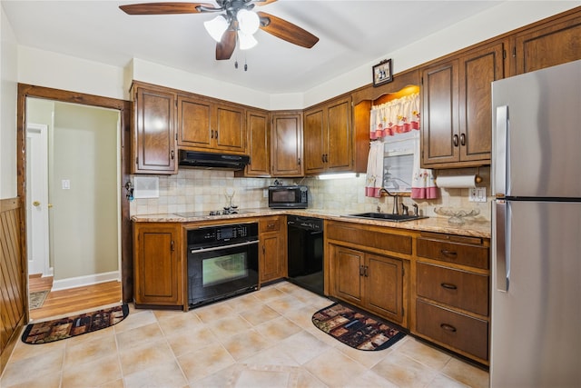 624 Westminster Rd, Baldwin, NY 11510 - kitchen with black appliances, a ceiling fan, a sink, under cabinet range hood, and tasteful backsplash