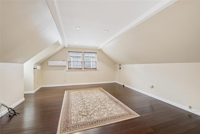 624 Westminster Rd, Baldwin, NY 11510 - bonus room with baseboards, lofted ceiling, dark wood-style flooring, and a wall mounted air conditioner