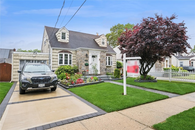 624 Westminster Rd, Baldwin, NY 11510 - cape cod-style house with stone siding, a shingled roof, and concrete driveway
