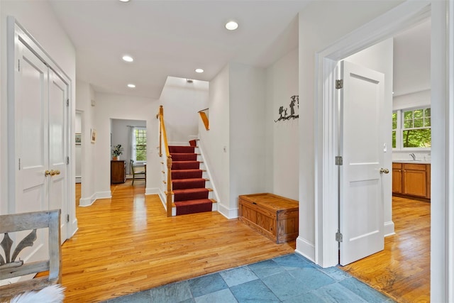 7 Ravine Dr, Hastings-On-Hudson, NY 10706 - foyer entrance with light wood-type flooring, stairs, baseboards, and recessed lighting