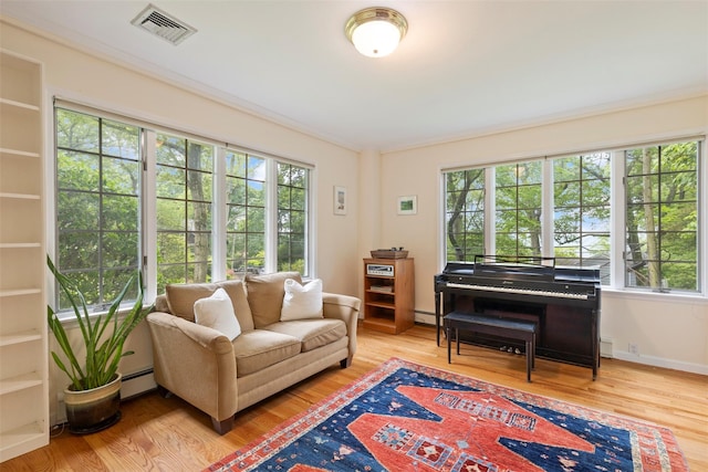 7 Ravine Dr, Hastings-On-Hudson, NY 10706 - living area featuring a baseboard heating unit and wood finished floors