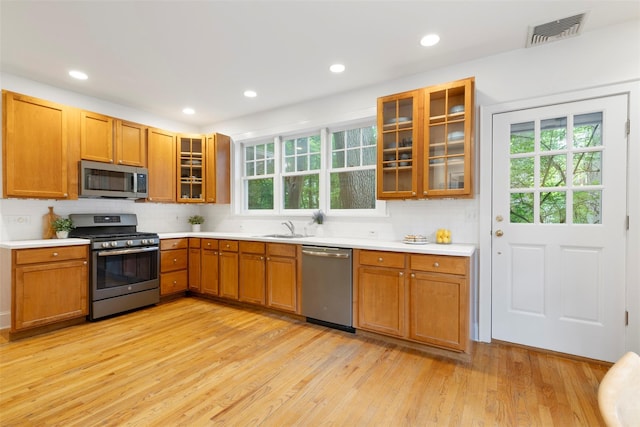 7 Ravine Dr, Hastings-On-Hudson, NY 10706 - kitchen with stainless steel appliances, a sink, light wood-style floors, plenty of natural light, and recessed lighting