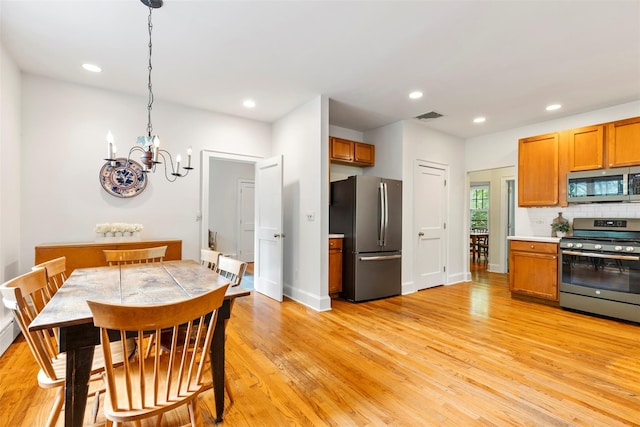 7 Ravine Dr, Hastings-On-Hudson, NY 10706 - dining space with a chandelier, light wood-style floors, recessed lighting, and baseboards