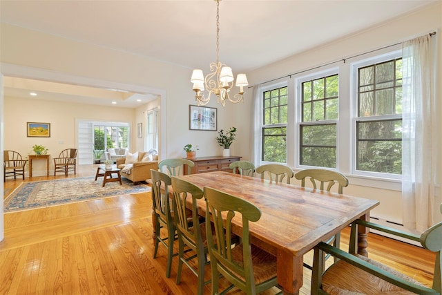 7 Ravine Dr, Hastings-On-Hudson, NY 10706 - dining space with light wood-type flooring, a chandelier, a baseboard heating unit, and recessed lighting