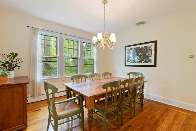 7 Ravine Dr, Hastings-On-Hudson, NY 10706 - dining space featuring light wood-type flooring, a chandelier, baseboards, and baseboard heating