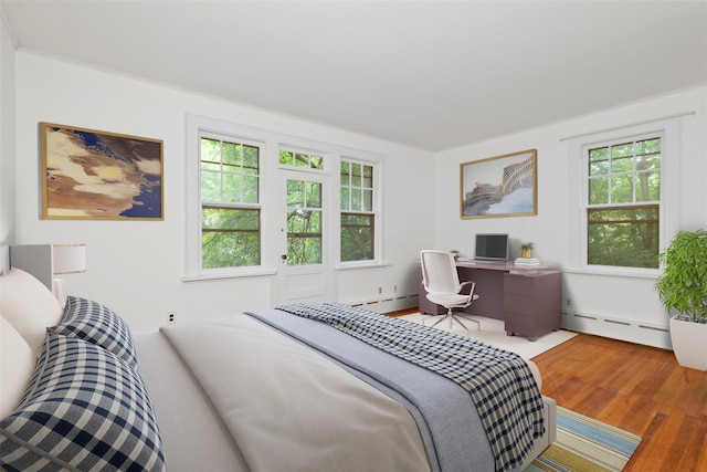 7 Ravine Dr, Hastings-On-Hudson, NY 10706 - bedroom featuring baseboard heating and wood finished floors