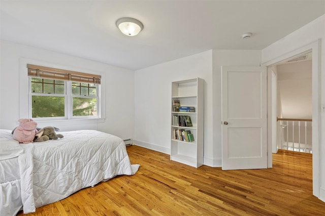 7 Ravine Dr, Hastings-On-Hudson, NY 10706 - bedroom featuring wood finished floors and baseboards