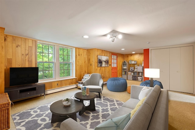 7 Ravine Dr, Hastings-On-Hudson, NY 10706 - carpeted living room with wood walls, a baseboard heating unit, and recessed lighting