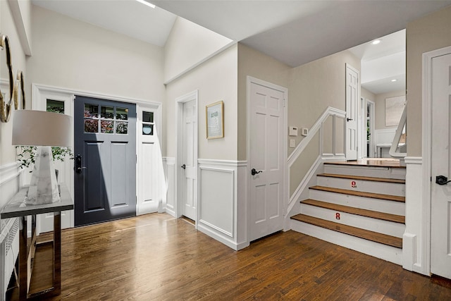 68 Greenhaven Rd, Rye, NY 10580 - foyer with wood finished floors, stairs, a wainscoted wall, a decorative wall, and recessed lighting