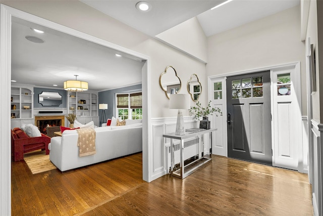 68 Greenhaven Rd, Rye, NY 10580 - foyer featuring wood finished floors, wainscoting, a lit fireplace, and recessed lighting