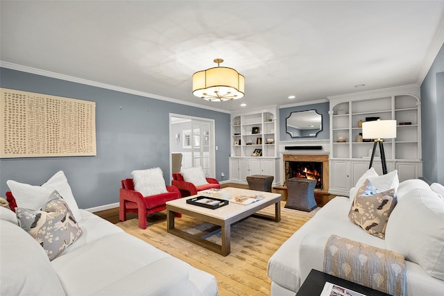 68 Greenhaven Rd, Rye, NY 10580 - living room featuring wood finished floors, ornamental molding, a warm lit fireplace, a chandelier, and recessed lighting