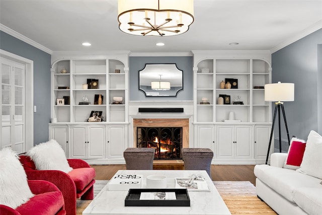 68 Greenhaven Rd, Rye, NY 10580 - living room with a chandelier, ornamental molding, wood finished floors, recessed lighting, and a fireplace