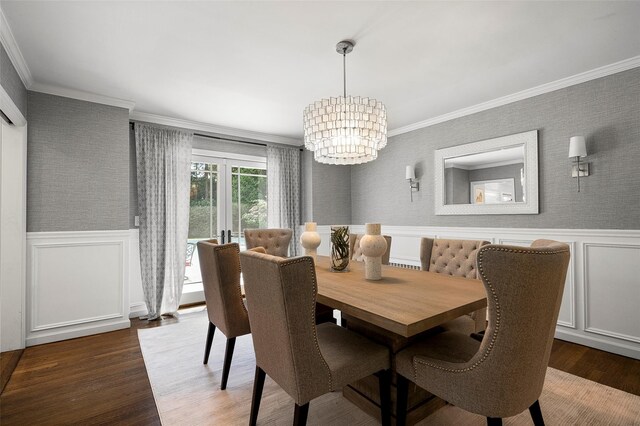 68 Greenhaven Rd, Rye, NY 10580 - dining area featuring wainscoting, ornamental molding, a chandelier, wood finished floors, and a decorative wall