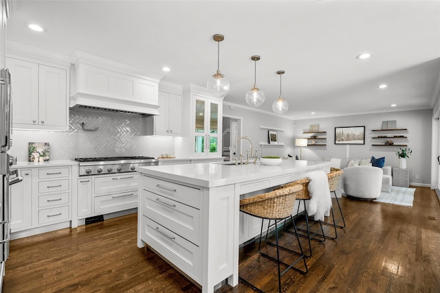 68 Greenhaven Rd, Rye, NY 10580 - kitchen featuring crown molding, open floor plan, recessed lighting, stainless steel gas cooktop, and a kitchen breakfast bar