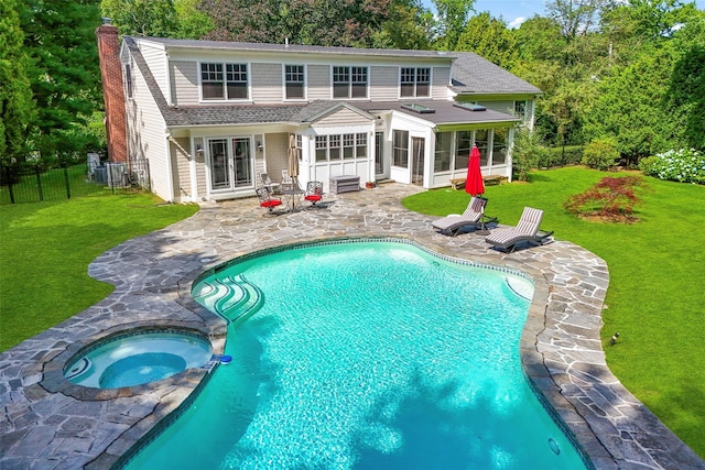 68 Greenhaven Rd, Rye, NY 10580 - rear view of property with a sunroom, a patio area, a chimney, a shingled roof, and french doors