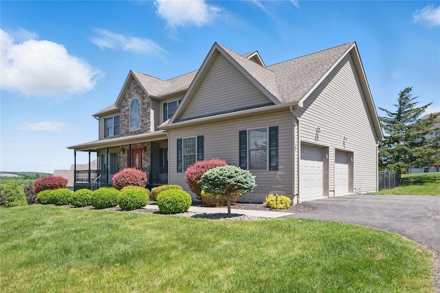 15 Prestwick Dr, Monroe, NY 10950 - view of front of property with driveway, a front lawn, a garage, a porch, and a shingled roof