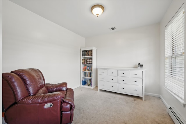 15 Prestwick Dr, Monroe, NY 10950 - sitting room with a baseboard radiator, light carpet, and baseboards