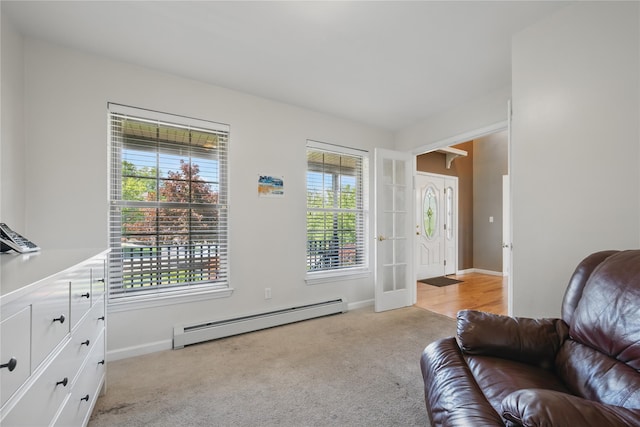 15 Prestwick Dr, Monroe, NY 10950 - living room featuring baseboard heating, light carpet, plenty of natural light, and baseboards
