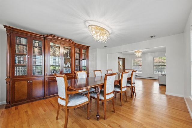 15 Prestwick Dr, Monroe, NY 10950 - dining space featuring a chandelier, light wood-style floors, and baseboards