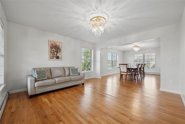 15 Prestwick Dr, Monroe, NY 10950 - living room with a chandelier, healthy amount of natural light, and light wood-style flooring