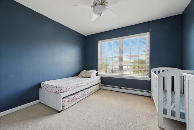 15 Prestwick Dr, Monroe, NY 10950 - carpeted bedroom featuring baseboard heating, ceiling fan, and baseboards