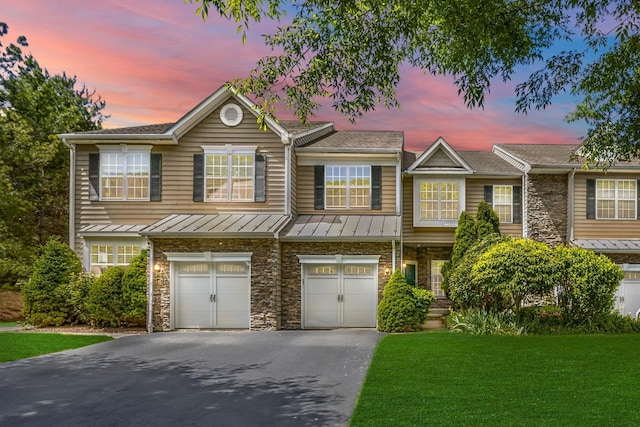 837 Huntington Dr Unit 152, Fishkill, NY 12524 - multi unit property featuring driveway, a standing seam roof, stone siding, an attached garage, and a front yard