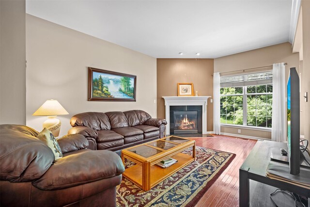 837 Huntington Dr Unit 152, Fishkill, NY 12524 - living room featuring wood-type flooring and a fireplace with flush hearth