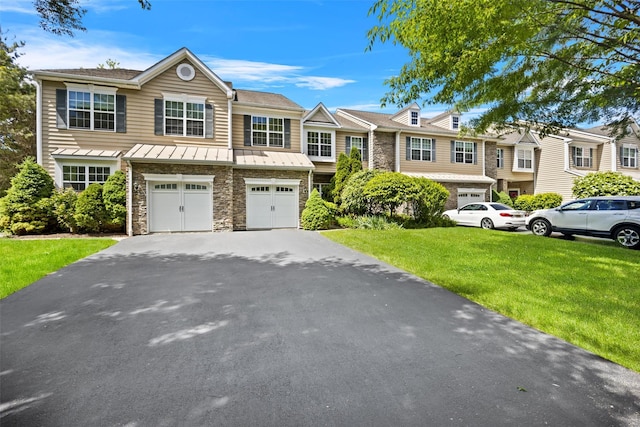 837 Huntington Dr Unit 152, Fishkill, NY 12524 - multi unit property with a standing seam roof, a garage, stone siding, and driveway