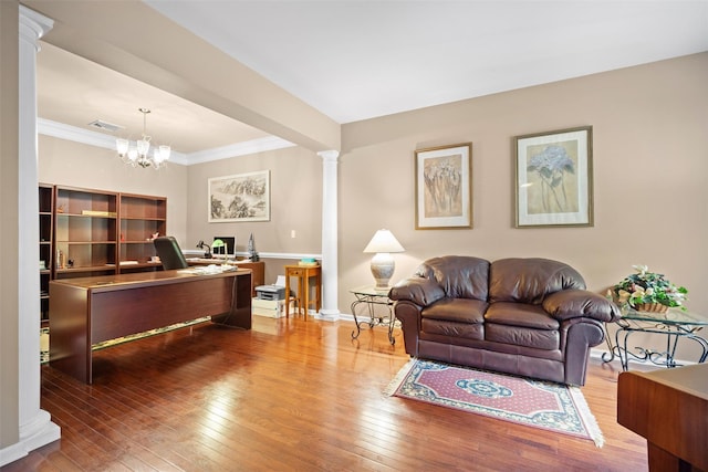 837 Huntington Dr Unit 152, Fishkill, NY 12524 - living room featuring decorative columns, wood-type flooring, a desk, crown molding, and a chandelier