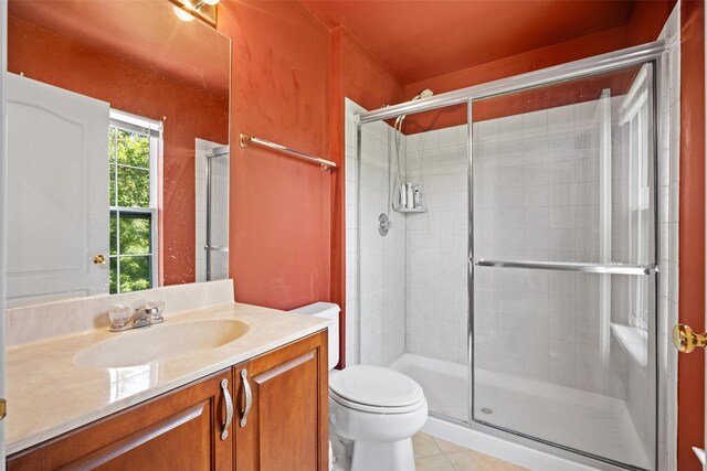837 Huntington Dr Unit 152, Fishkill, NY 12524 - full bath with vanity, toilet, a shower stall, and tile patterned flooring