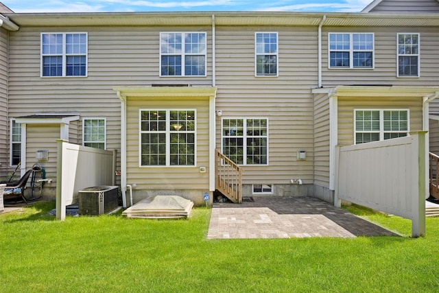 837 Huntington Dr Unit 152, Fishkill, NY 12524 - back of property featuring central AC unit and a patio