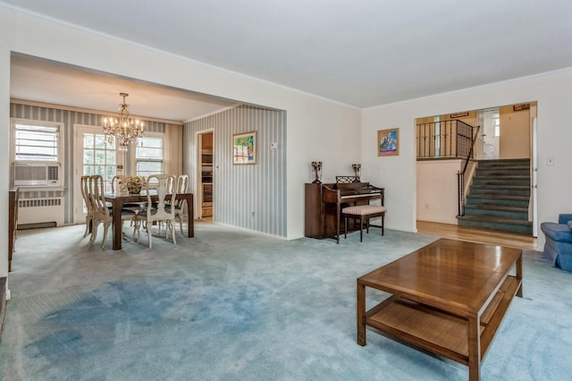 409 Jordan St, Oceanside, NY 11572 - living area featuring radiator heating unit, ornamental molding, a chandelier, stairway, and carpet floors