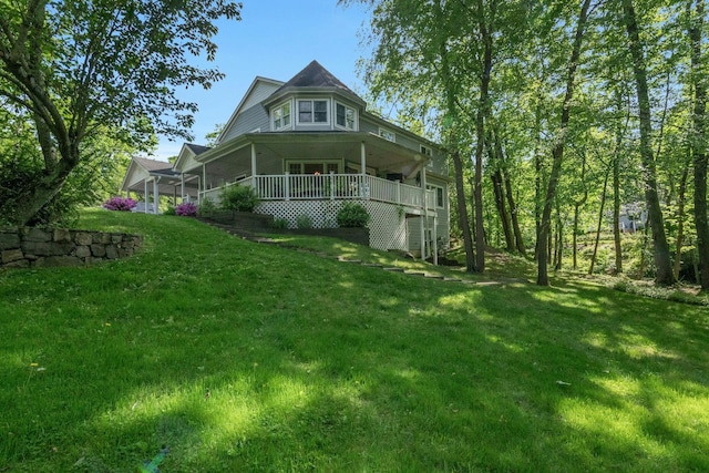 416 Sleepy Hollow Rd, Briarcliff Manor, NY 10510 - back of property with a lawn and covered porch