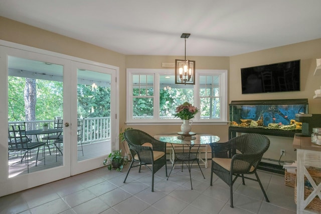 416 Sleepy Hollow Rd, Briarcliff Manor, NY 10510 - tiled dining space featuring healthy amount of natural light, a chandelier, and french doors