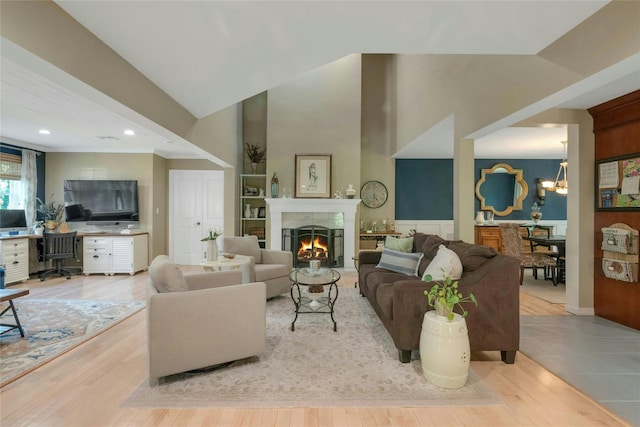 416 Sleepy Hollow Rd, Briarcliff Manor, NY 10510 - living area featuring recessed lighting, a desk, wood finished floors, high vaulted ceiling, and a fireplace