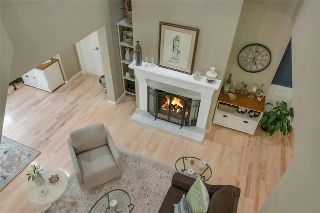 416 Sleepy Hollow Rd, Briarcliff Manor, NY 10510 - living room with wood finished floors and a warm lit fireplace