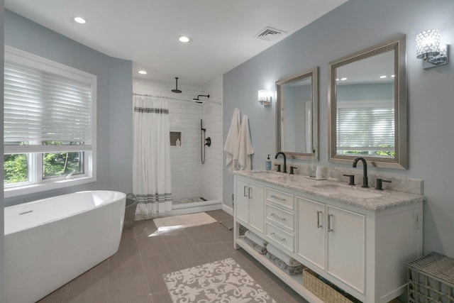 416 Sleepy Hollow Rd, Briarcliff Manor, NY 10510 - bathroom featuring a stall shower, double vanity, a freestanding bath, and recessed lighting