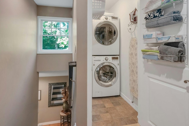 416 Sleepy Hollow Rd, Briarcliff Manor, NY 10510 - laundry area featuring stacked washing machine and dryer and baseboards