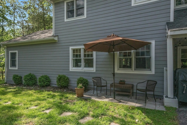 416 Sleepy Hollow Rd, Briarcliff Manor, NY 10510 - rear view of property with a patio, roof with shingles, and a yard
