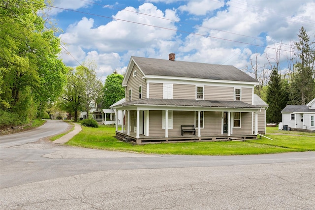 1 Green St, Gilbertsville, NY 13776 - farmhouse featuring a chimney, a porch, and a front yard