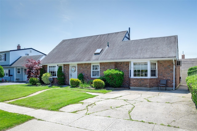 98 Bluespruce Rd, Levittown, NY 11756 - view of front facade with a front lawn, brick siding, and roof with shingles