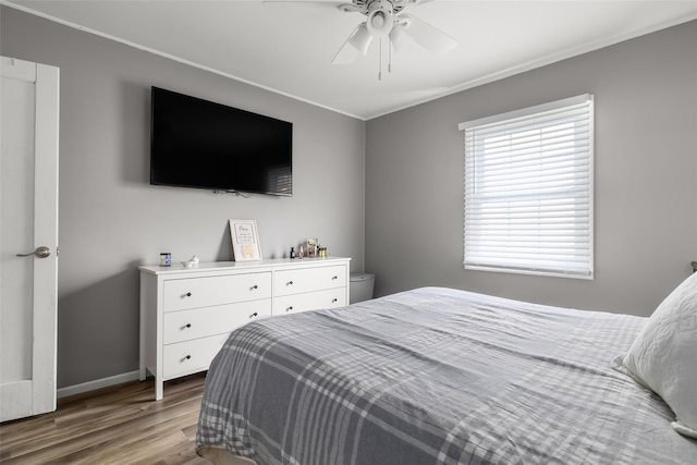 98 Bluespruce Rd, Levittown, NY 11756 - bedroom with wood finished floors, ornamental molding, baseboards, and ceiling fan