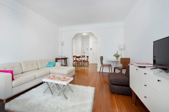 35-53 77th St Unit 5H, Jackson Heights, NY 11372 - living area with arched walkways, light wood-style floors, and ornamental molding