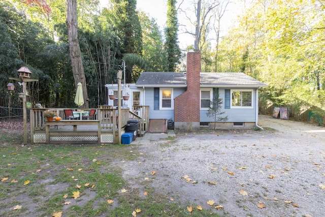 137C Shore Rd, Mount Sinai, NY 11766 - view of front facade featuring a wooden deck and a chimney