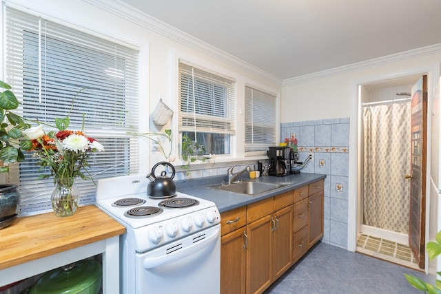 137C Shore Rd, Mount Sinai, NY 11766 - kitchen featuring white electric stove, a sink, brown cabinetry, tile patterned floors, and tile walls