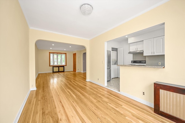 21-22 150th St, Whitestone, NY 11357 - unfurnished living room with arched walkways, crown molding, light wood-style flooring, baseboards, and recessed lighting
